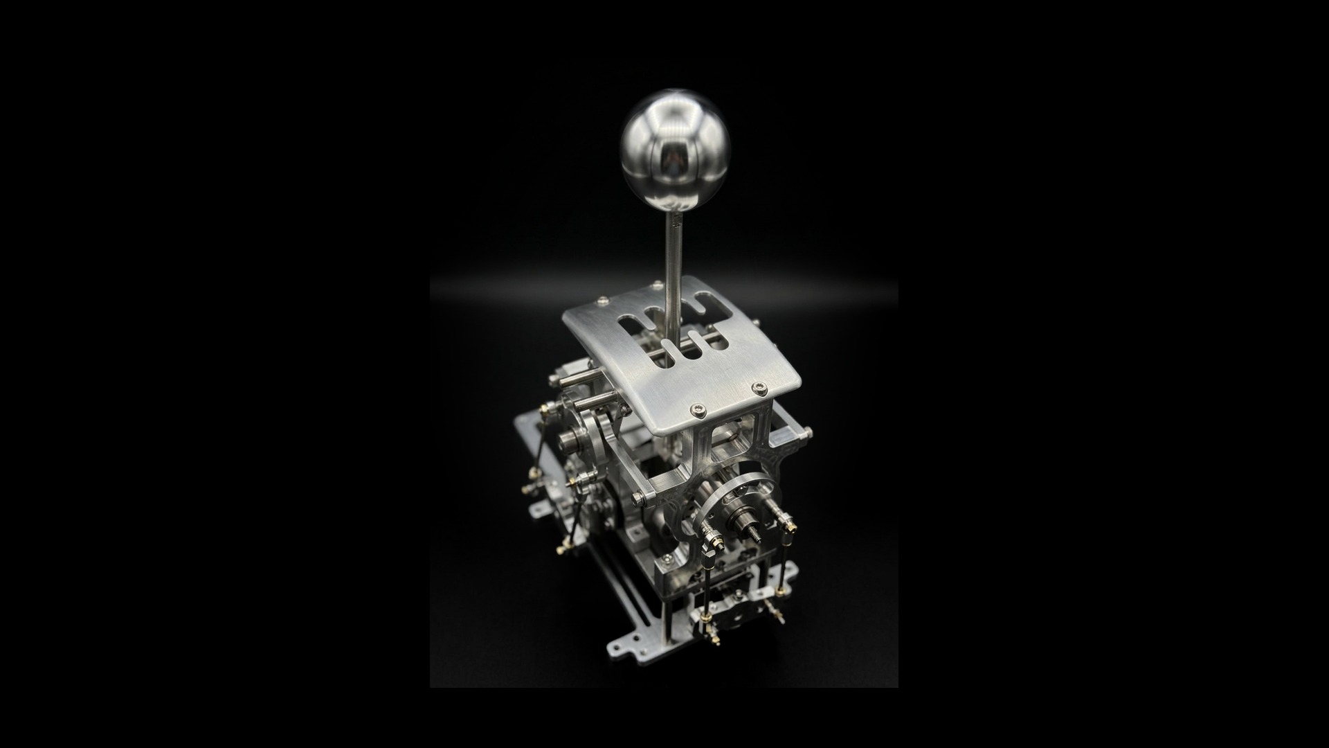 Limitless Engineering billet Quickshift mechanism with polished sphere knob on a black background